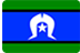 The image is of the Torres Strait Islander flag, featuring green horizontal stripes at the top and bottom, a blue field with a white Dhari (headdress) in the center, and a white star beneath the Dhari.